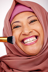 Image showing Cosmetic brush, portrait and muslim woman in studio for makeup, natural and face routine. Smile, self care and happy mature islamic female model with cosmetology tool for facial glamour treatment.