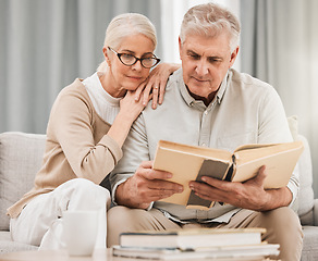 Image showing God, worship and senior couple with bible on a sofa relax with scripture, study or reading in their home. Holy, book and retired people in a living room with gospel, faith and Jesus Christ praise