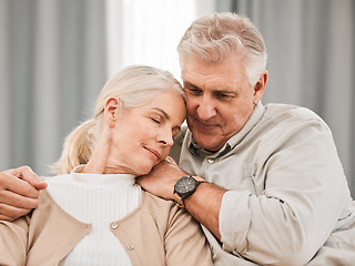 Image showing Old people, hug and relax on sofa with love and support, bonding while at home with trust and comfort. Couple with time together, marriage or life partner with retirement, calm and peace of mind