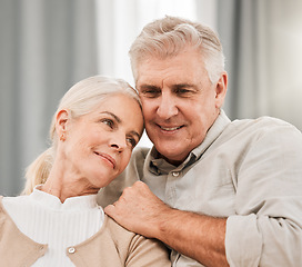 Image showing Old couple, hug and relax on sofa with love and support, bonding while at home with trust and comfort. People with time together, marriage or life partner with retirement, calm and peace of mind