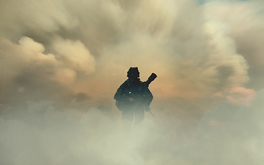 Image showing Man, soldier or army with silhouette in smoke, dust and alone in overlay with weapon, rifle or gun in mockup. Male, person and walk for battle, war or mission in intelligence, security or training