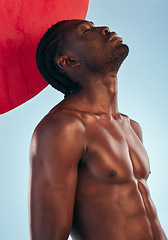 Image showing Art, body and black man thinking with style, creative graphic and red dot with fitness and workout in studio. Blue background, male model and fit muscle with skin glow, power and chest with profile