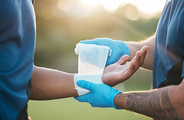 Image showing Sports, injury and man with bandage on wrist for accident, emergency and first aid for muscle sprain. Fitness, healthcare and medic with athlete with arm pain from exercise, workout and training