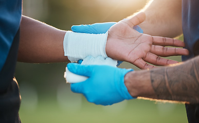 Image showing Sports, wrist injury and people with bandage for accident, emergency and first aid for muscle sprain. Fitness, healthcare and medic with athlete with arm pain from exercise, workout and training