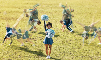 Image showing Cheerleader blur, sports and women on grass for performance, dance and motivation for game. Teamwork, dancer and people in costume cheer for support in match, competition and field event outdoors