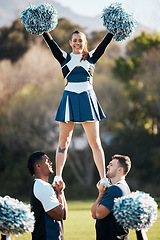 Image showing Cheerleader, sports and men balance woman on field for performance, dance and game motivation. Teamwork, dancer and people in costume cheer for support in match, competition and event outdoors