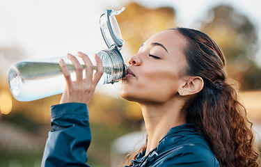 Image showing Outdoor, fitness and woman drinking water, health and workout with hydration, wellness and sports. Person outdoor, girl and athlete with liquid, bottle and thirsty with nutrition, detox and exercise