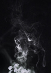 Image showing Smoke, fog and air on dark background, pollution with vapor wave and cloud of gas in a studio. Texture, steam or spray with mystery, incense or mist, dry ice with special effects and moving smog