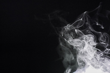 Image showing Smoke, dark background and mist, fog or gas on mockup space wallpaper. Cloud, smog and magic effect on black backdrop of steam with abstract texture, dry ice pattern or vapor of incense moving in air