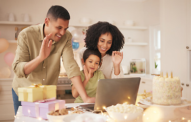 Image showing Laptop, video call and family with birthday celebration in a kitchen happy, excited and love in their home. Virtual, party and hello by parents with child online with cake, gift or waving gesture