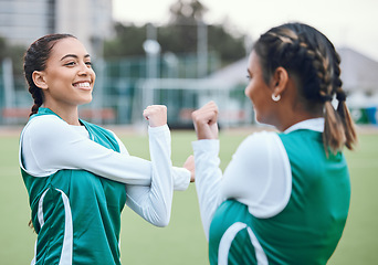 Image showing Hockey, fitness and women stretching in team training, practice or sports workout exercise on turf. Teamwork, smile or happy female athlete with flexibility ready to start a game in warm up together