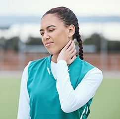 Image showing hockey, sports accident or woman with injury or neck pain after workout exercises or fitness training alone. Hurt, girl or injured sports athlete holding sore muscle after bad accident or emergency