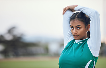 Image showing Thinking, stretching and a woman hockey player getting ready for the start of a game or competition outdoor. Sports, fitness and warm up with a young athlete on a field for a training workout