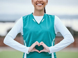 Image showing Healthy, heart hands or happy athlete on field for fitness, exercise or workout for cardiovascular health. Love sign, hand gesture or sports woman in a training game for wellness or hockey practice