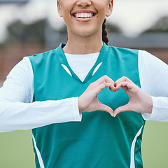 Image showing Sports, heart hands or happy athlete on field for fitness, exercise or workout for cardiovascular health. Love sign, hand gesture or healthy woman in a training game for wellness or hockey practice