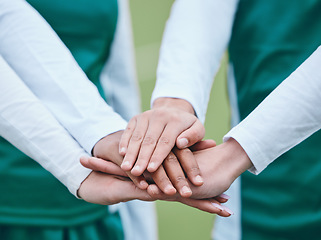 Image showing Stack, sports or hands of team in huddle with support, solidarity or plan for a hockey training game. Group, turf closeup or athletes in practice for fitness exercise or match together for teamwork