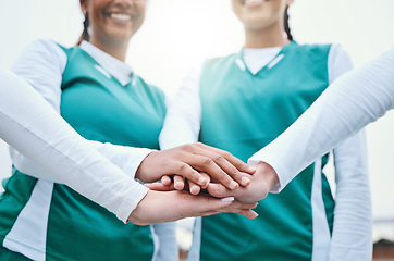 Image showing Hands, sports women or team in huddle with support, smile or plan for a hockey training game. Low angle, stack or happy female athletes in practice for exercise or match together with pride or unity