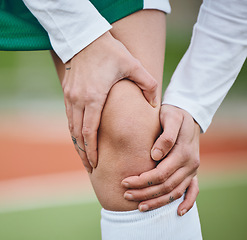 Image showing Sports, knee pain or athlete with an injury on field or turf struggling with fracture in game or match. Fitness workout, emergency or closeup of person suffering from an accident outdoor in training