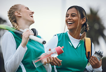 Image showing Funny, team sports or women in conversation on turf or court for break after fitness training or exercise. Smile, happy friends or female hockey players walking, laughing or talking to relax together