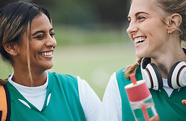 Image showing Laughing, team sports or women in conversation on turf or court for break after fitness training or exercise. Smile, happy friends or funny female hockey players speaking or talking to relax together