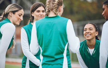 Image showing Sports, hockey team and women talking outdoor at field together for competition training. Fitness, happy group of girls and collaboration for workout, exercise for healthy body and planning strategy