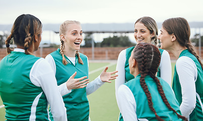 Image showing Sports, hockey team and women talking outdoor at field together for competition training. Fitness, happy group of girls and collaboration for workout, exercise for healthy body and planning strategy