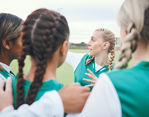 Image showing Sport, women and group for team building meeting, solidarity and diversity on field outdoor in nature. Hockey, girls and hug for unity, teamwork and game discussion with strategy and collaboration