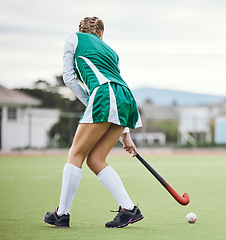 Image showing Field, hockey and woman running in game, tournament or competition with ball, stick and action on artificial grass. Sports, athlete and play in training, exercise or workout on green, pitch or ground