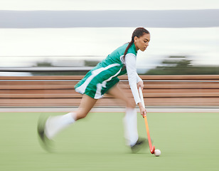 Image showing Hockey, sports or woman running in game, tournament or competition with ball, stick or action on turf. Blur, training or fast girl player in exercise, workout or motion on artificial grass for speed