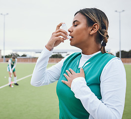 Image showing Asma, hockey woman and medical tool for breathing and healthcare outdoor on sport field. Female student, fitness and exercise in a game with training and workout with breathe for wellness and stress