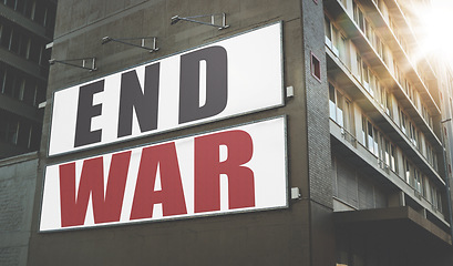Image showing Billboard, poster and information on building, wall and war, propaganda or advertising activism campaign in city. End, conflict and sign or banner to protest politics, violence or global crisis