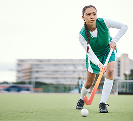 Image showing Field, hockey and woman running in game, tournament or competition with ball, stick and action on artificial grass. Sports, athlete and play in training, exercise or workout on green, pitch or ground