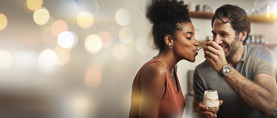 Image showing Love, dessert and feeding with a couple on space in their home together for romance or dating. Smile, mockup or banner with an interracial man and woman eating in the kitchen on their anniversary