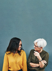 Image showing Happy, conversation and women by a wall with mockup space for advertising, promotion or marketing. Smile, talking and female people in discussion together with comic or funny joke by gray background.