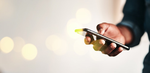 Image showing Businessman, hand and smartphone in closeup for communication in overlay, bokeh and banner for mockup. Black, person or worker for digital marketing, social media or fintech in office on internet