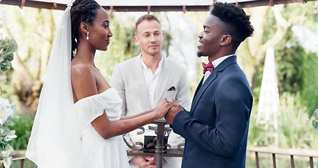 Image showing Happy black couple, wedding and vows in marriage, commitment or support together at alter. Married African woman and man holding hands for love, trust or speech of bride or groom in outdoor romance