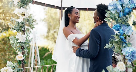 Image showing Happy black couple, wedding and kiss for love, marriage or commitment in support together. Married African woman and man kissing in embrace, trust or relationship of bride or groom in outdoor romance