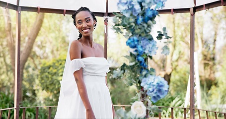 Image showing Woman, portrait and bride at wedding reception, flowers and smiling with happiness, joy and dress. Marriage, outdoor and fashion model for bridal outfit, venue and commitment ceremony celebration