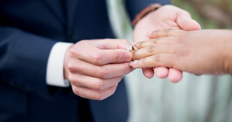 Image showing Couple, hands and ring for marriage, commitment or wedding in ceremony, love or support together. Closeup of people getting married, vows or accessory for symbol of bond, relationship or partnership