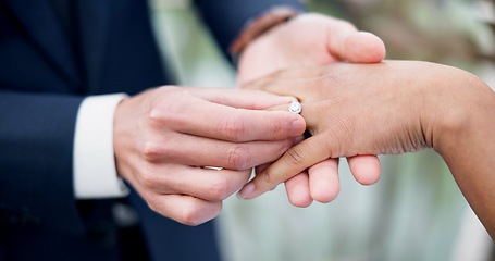 Image showing Couple, hands and ring for marriage, love or wedding in ceremony, commitment or support together. Closeup of people getting married, vows or accessory for symbol of bond, relationship or partnership