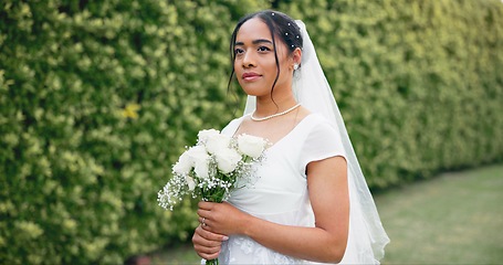 Image showing Wedding in garden, portrait of bride with bouquet of roses and smile for celebration of love, future and commitment. Outdoor marriage ceremony, excited and happy woman with flowers, nature and beauty