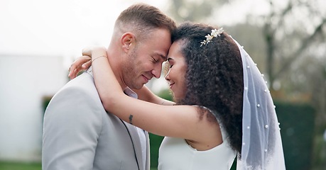 Image showing Wedding, couple and love dancing outdoor together, happy and celebration for care and commitment. Marriage, man and woman moving with eyes closed, bride and groom embrace for first dance in nature