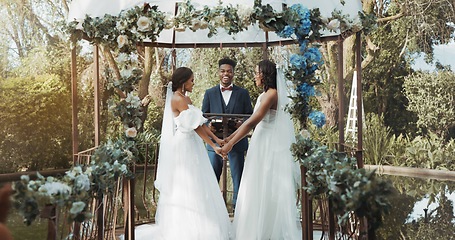 Image showing Women, lesbian wedding and ceremony outdoor with priest for love, celebration or together for commitment. Gay marriage, event and party with bride, black man or vows in nature, lgbtq couple or garden