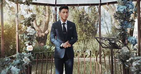 Image showing Groom, waiting and man in wedding or ceremony at alter with anxiety, stress or nervous energy for marriage or commitment. Formal, suit and excited person standing in aisle with flowers and nature