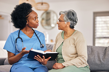 Image showing Bible, religion and assisted living caregiver with an old woman in a retirement home together. Healthcare, christian faith or belief with a nurse or volunteer reading to a senior patient in a house