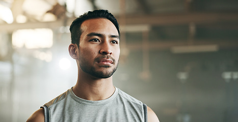 Image showing Thinking, serious and a man at the gym for fitness, exercise idea or health. Motivation, sports and an Asian athlete or person planning at a club for training, wellness or cardio for a routine