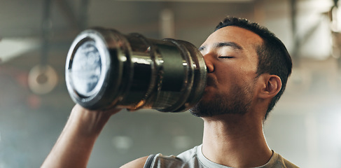 Image showing Happy asian man, fitness and drinking water after exercise, workout or training at indoor gym. Active and thirsty male person with mineral liquid for natural nutrition, sports diet or sustainability