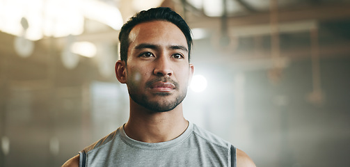 Image showing Thinking, serious and a man at the gym for fitness, exercise idea or health. Motivation, sports and an Asian athlete or person planning at a club for training, wellness or cardio for a routine