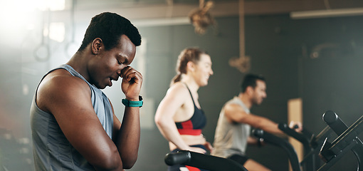 Image showing People, diversity and cycling on bicycle at gym in workout, exercise or intense cardio fitness together and motivation. Diverse group burning sweat on machine in healthy body, wellness or lose weight