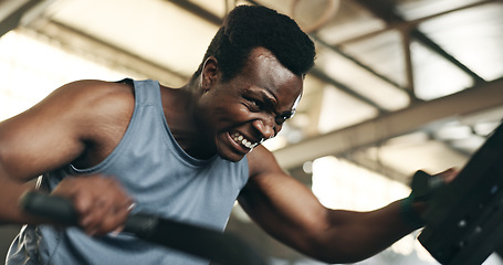 Image showing Black man, fitness and cycling at gym in cardio workout, exercise or intense training on machine. African male person on bicycle equipment in sweat or running for muscle, endurance or stamina at club